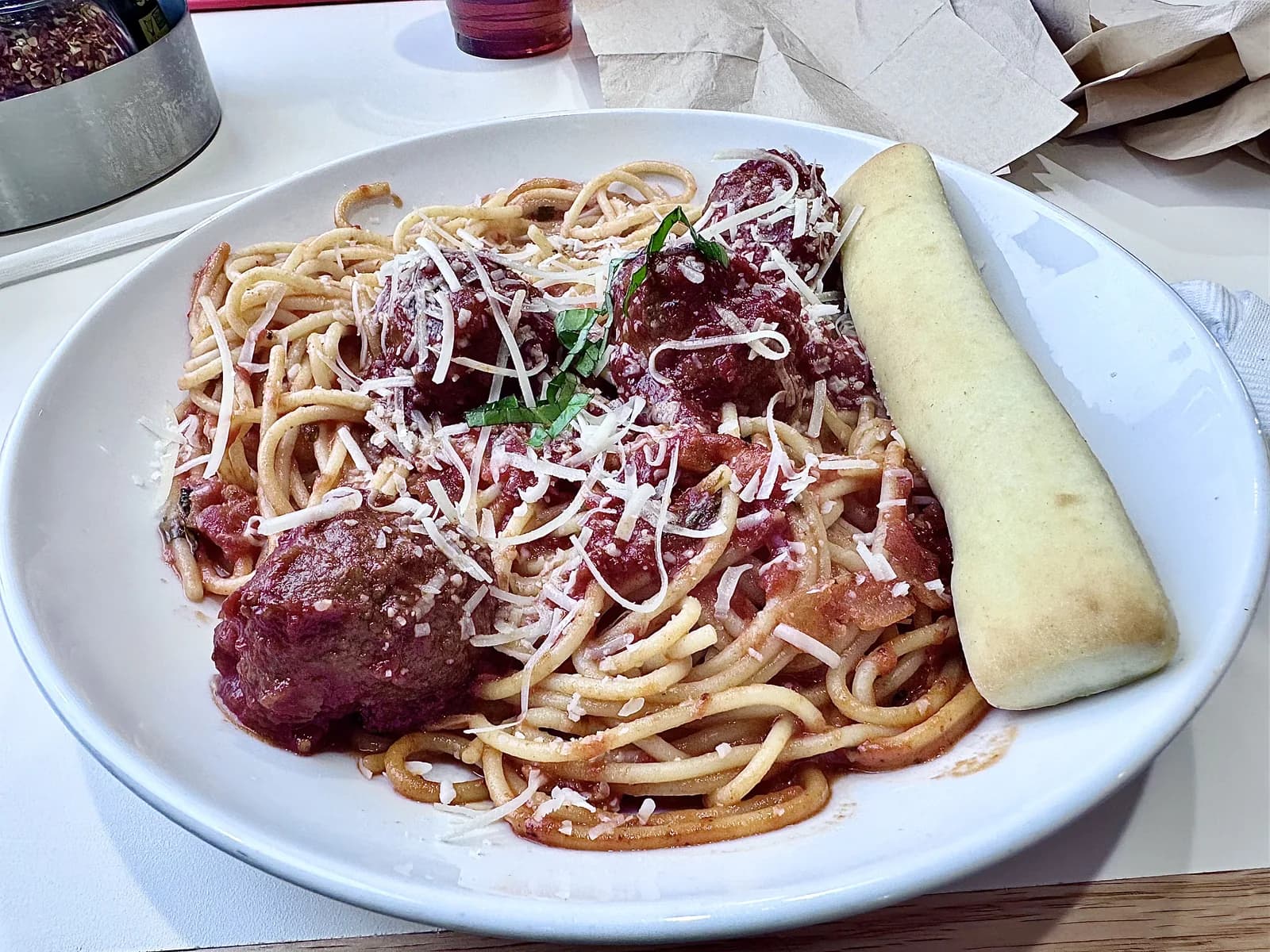 Spaghetti and meatballs with a breadstick at Nothing But Noodles in Lexington