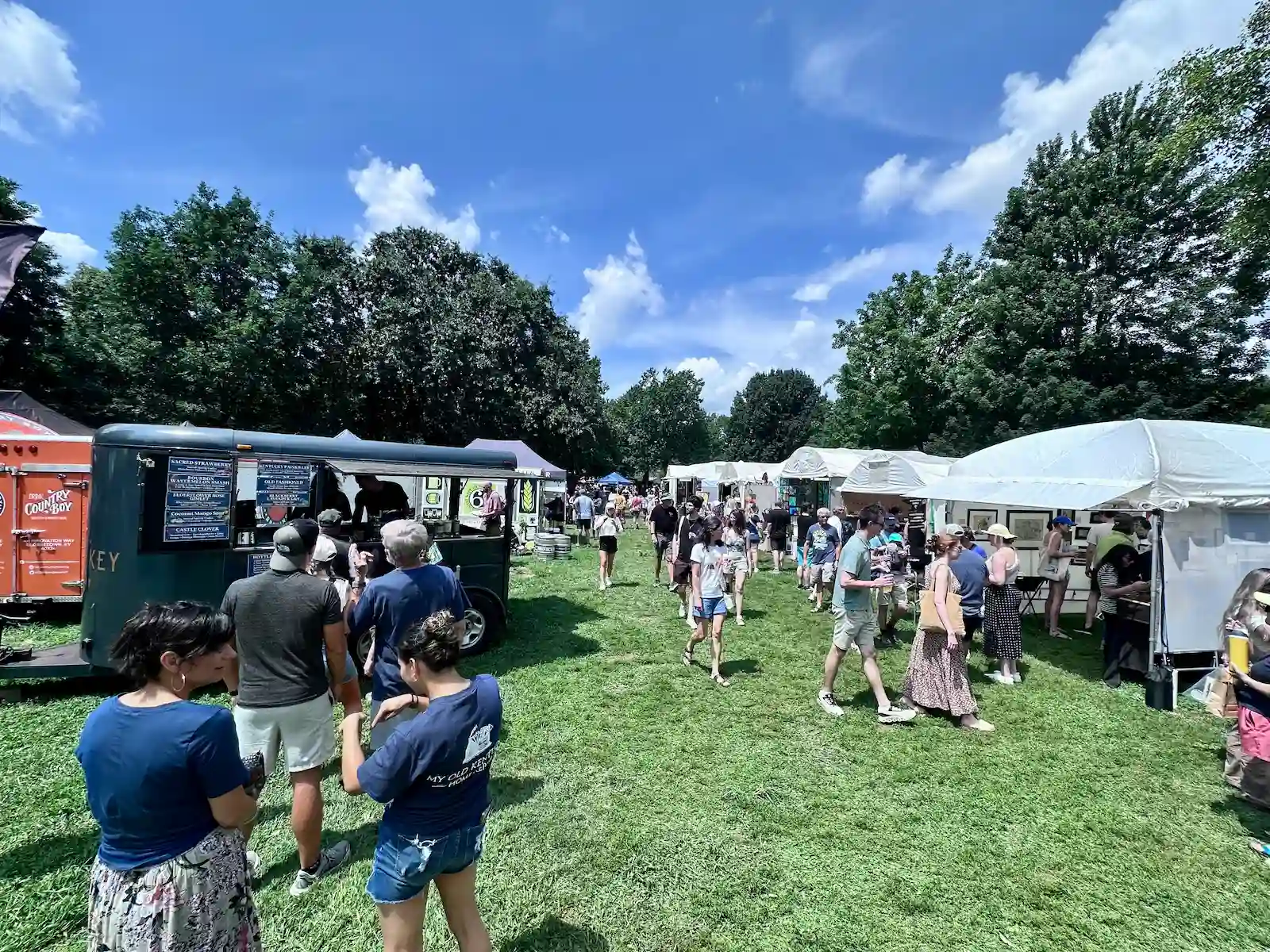 Crowds walking between artist booths at the Woodland Art Fair in Lexington