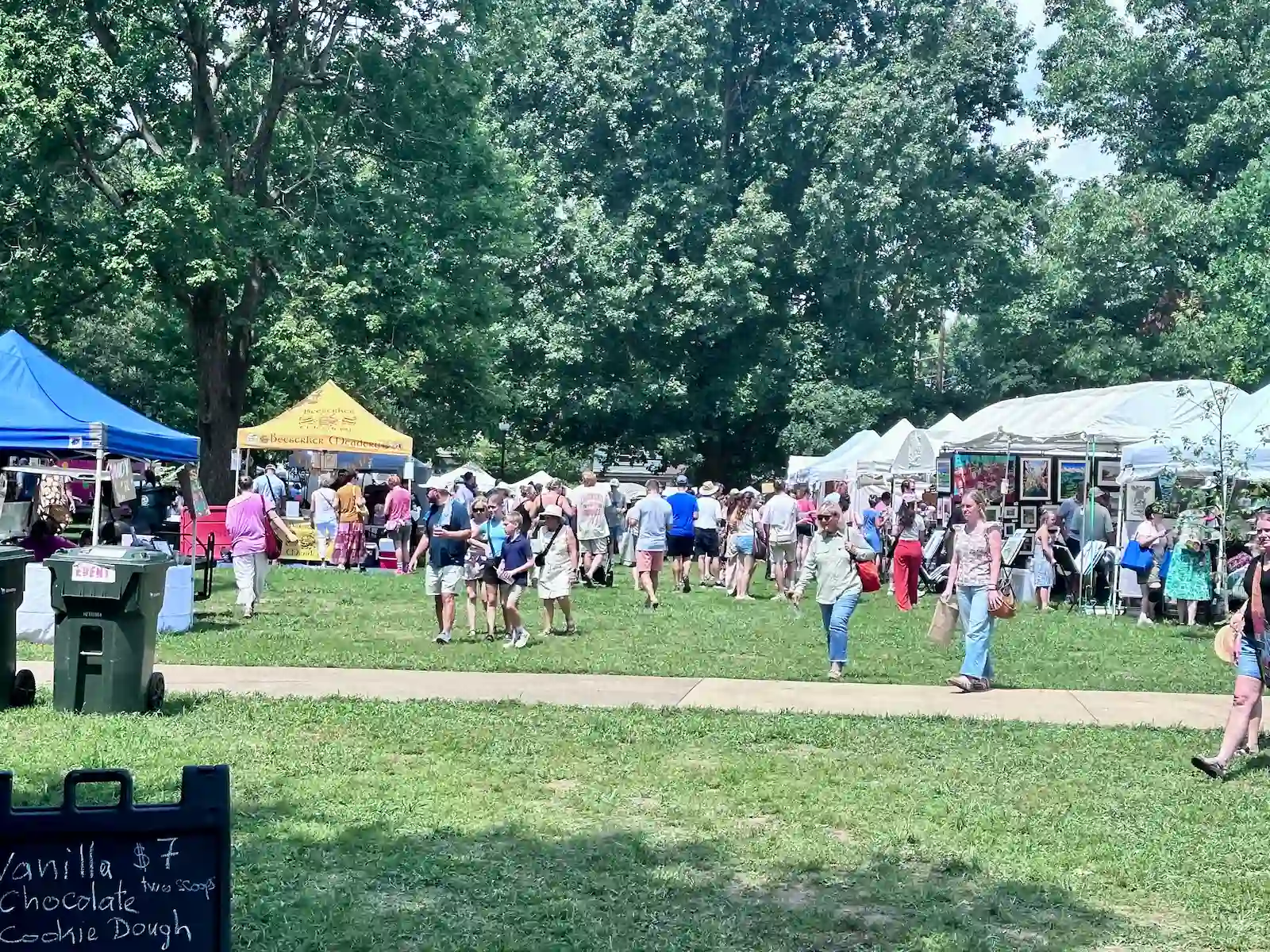 Rows of vendor tents and fairgoers at the 2026 Woodland Art Fair in Woodland Park